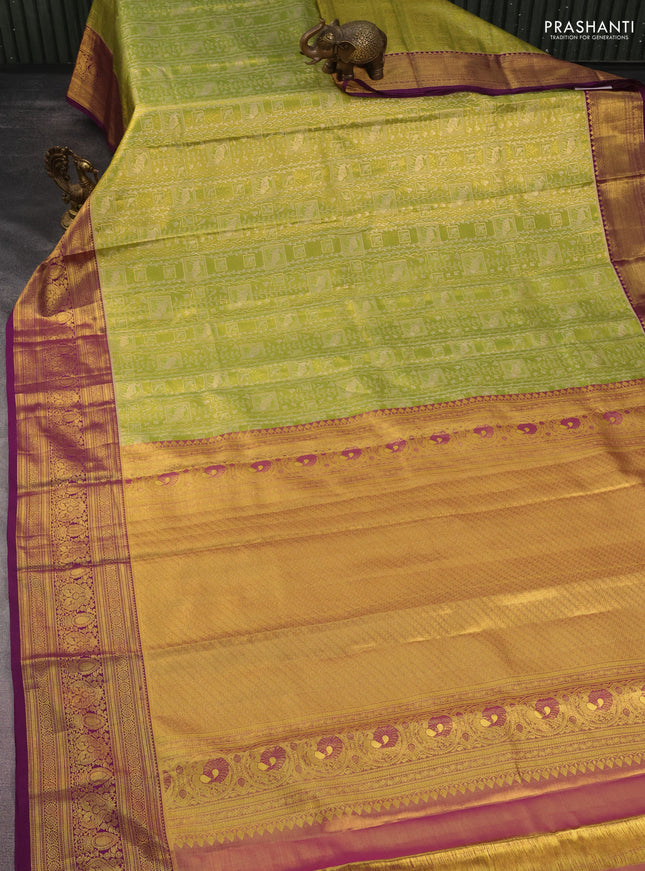 Kanchipuram tissue silk saree light green and purple with allover zari woven brocade weaves and rich zari woven border