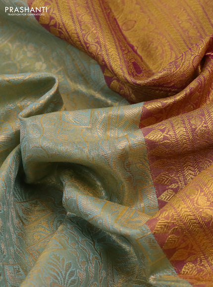 Kanchipuram tissue silk saree dual shade of teal blue and purple with allover zari woven brocade weaves and rich zari woven border