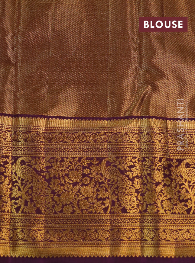 Kanchipuram tissue silk saree snadal and purple with allover zari woven floral brocade weaves and long rich zari woven border
