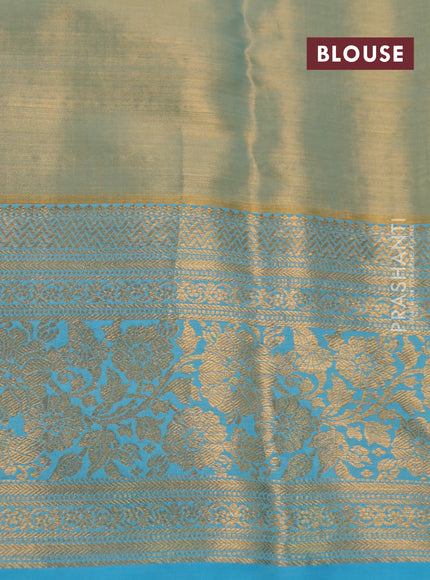 Kanchipuram tissue silk saree dual sahde of teal blue with allover zari woven brocade weaves and long rich zari woven floral border