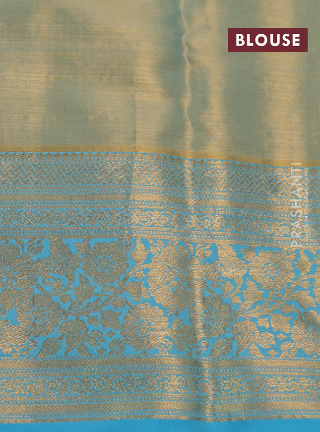 Kanchipuram tissue silk saree dual sahde of teal blue with allover zari woven brocade weaves and long rich zari woven floral border