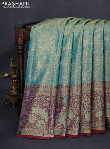 Kanchipuram tissue silk saree dual shade of teal green and maroon with allover floral zari woven brocade weaves and long rich zari woven border