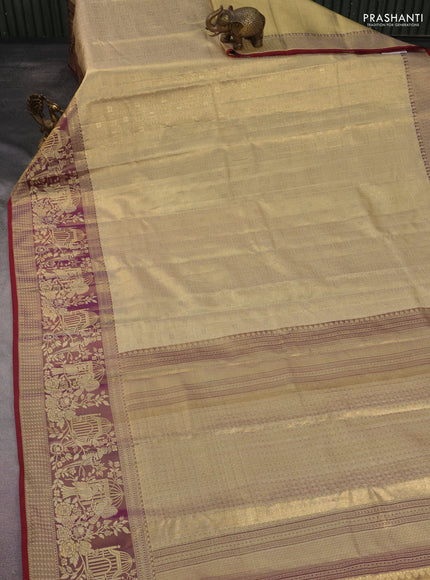 Kanchipuram tissue silk saree gold and maroon with allover zari woven brocade weaves and long rich zari woven border