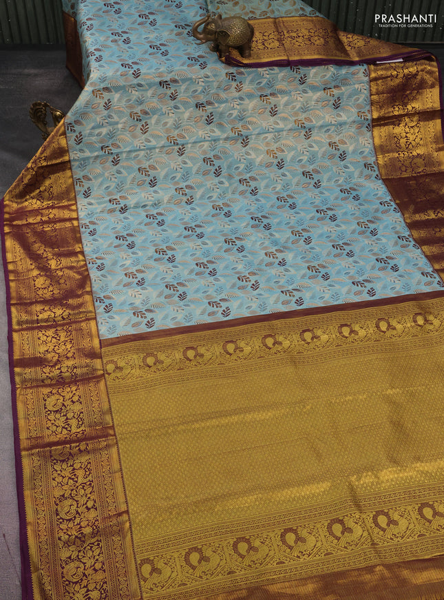 Kanchipuram tissue silk saree pastel blue and wine shade with allover zari woven leaf brocade weaves and long rich zari woven border
