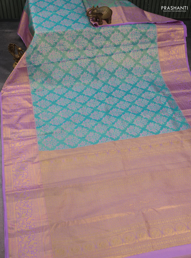 Kanchipuram tissue silk saree teal blue and lavender with allover zari woven floral brocade weaves and long rich zari woven border