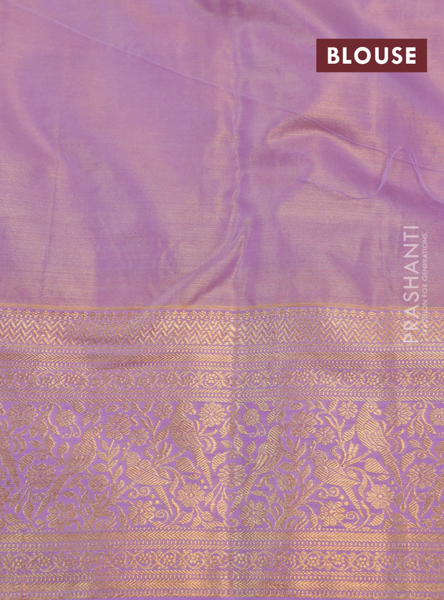 Kanchipuram tissue silk saree teal blue and lavender with allover zari woven floral brocade weaves and long rich zari woven border