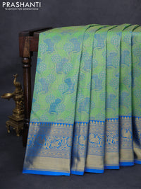 Kanchipuram tissue silk saree green and cs blue with allover zari woven brocade weaves and long rich zari woven border