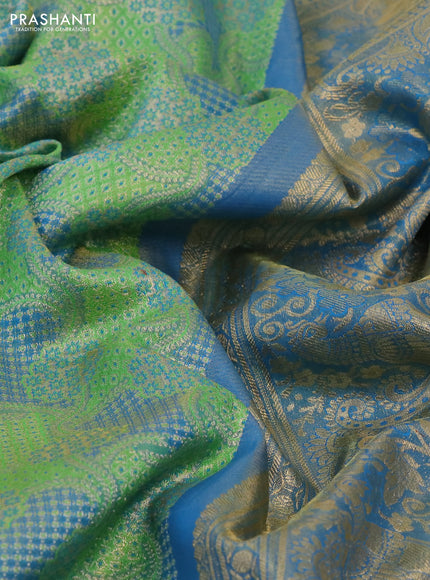 Kanchipuram tissue silk saree green and cs blue with allover zari woven brocade weaves and long rich zari woven border