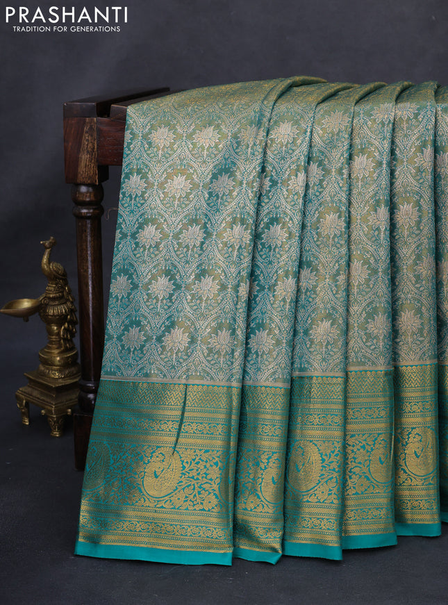 Kanchipuram tissue silk saree dual shade of teal green with allover zari woven brocade weaves and long rich zari woven border