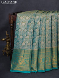 Kanchipuram tissue silk saree dual shade of teal green with allover zari woven brocade weaves and long rich zari woven border