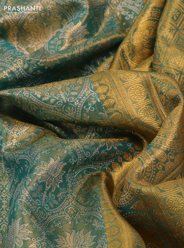 Kanchipuram tissue silk saree dual shade of teal green with allover zari woven brocade weaves and long rich zari woven border