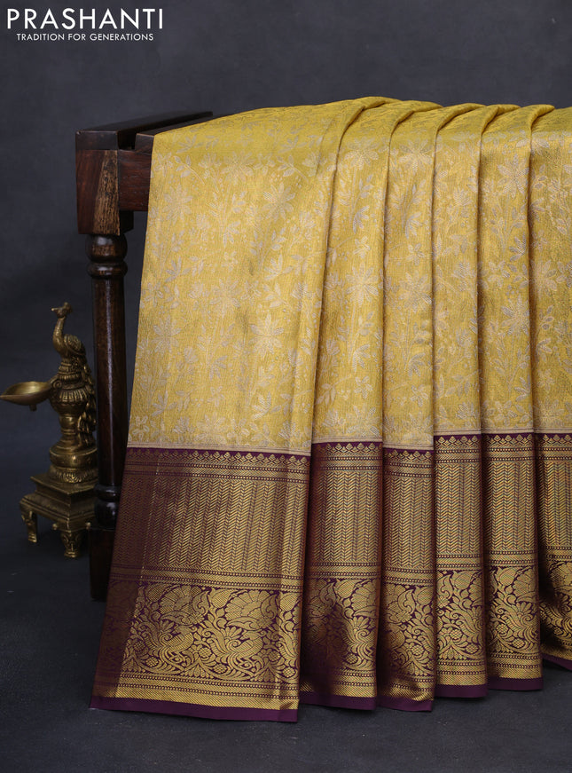 Kanchipuram tissue silk saree gold and wine shade with allover zari woven floral brocade weaves and long rich zari woven border