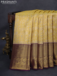 Kanchipuram tissue silk saree gold and wine shade with allover zari woven floral brocade weaves and long rich zari woven border