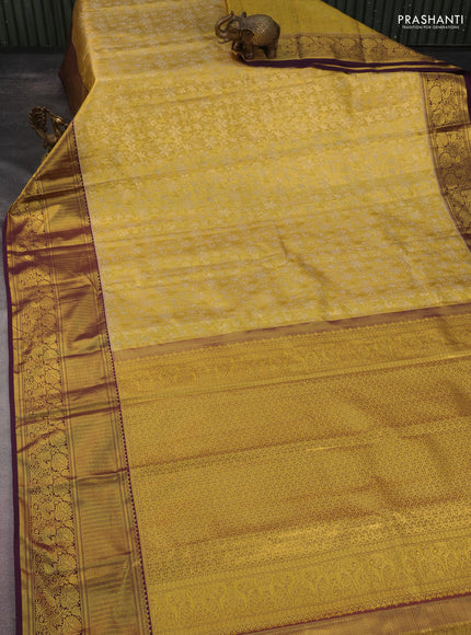 Kanchipuram tissue silk saree gold and wine shade with allover zari woven floral brocade weaves and long rich zari woven border