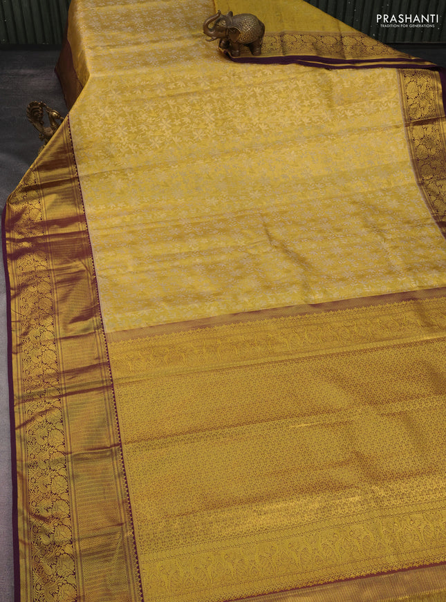 Kanchipuram tissue silk saree gold and wine shade with allover zari woven floral brocade weaves and long rich zari woven border