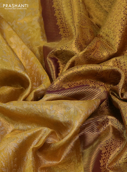 Kanchipuram tissue silk saree gold and wine shade with allover zari woven floral brocade weaves and long rich zari woven border