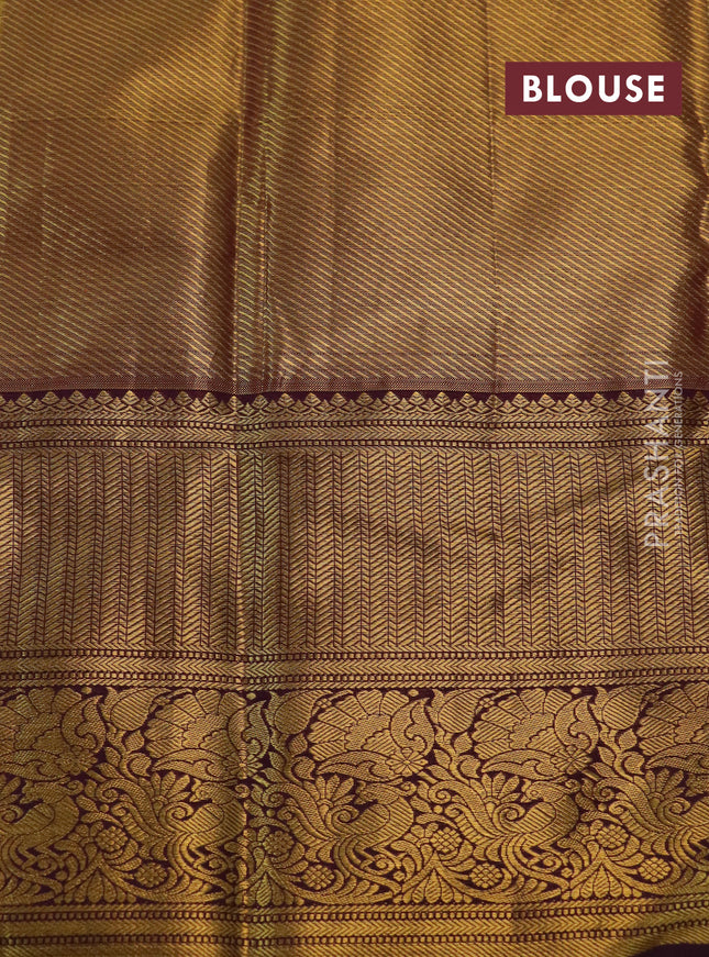 Kanchipuram tissue silk saree gold and wine shade with allover zari woven floral brocade weaves and long rich zari woven border