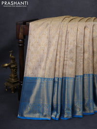 Kanchipuram tissue silk saree gold and cs blue with allover zari woven brocade weaves and long rich zari woven border