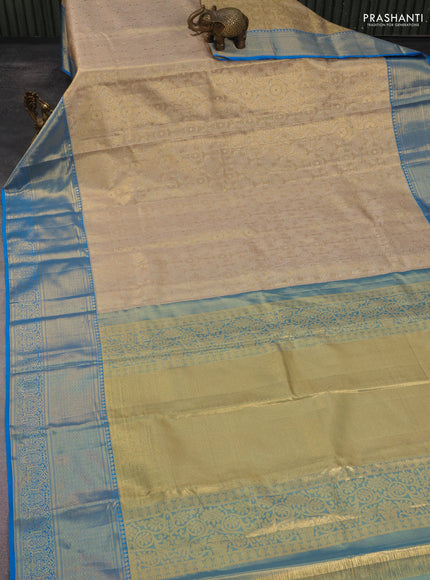 Kanchipuram tissue silk saree gold and cs blue with allover zari woven brocade weaves and long rich zari woven border