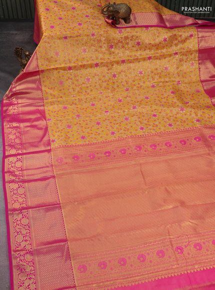 Kanchipuram tissue silk saree yellow and pink with allover zari woven brocade weaves and long rich zari woven border