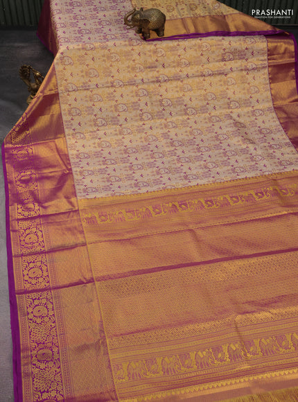 Kanchipuram tissue silk saree gold and purple with allover zari woven brocade weaves and long rich zari woven border