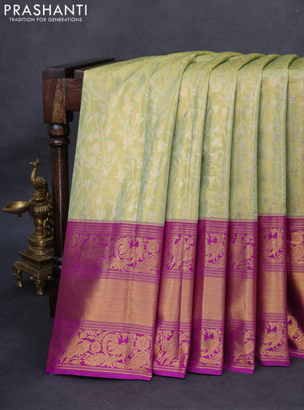Kanchipuram tissue silk saree pista green and purple with allover zari woven floral brocade weaves and long rich peacock zari woven border