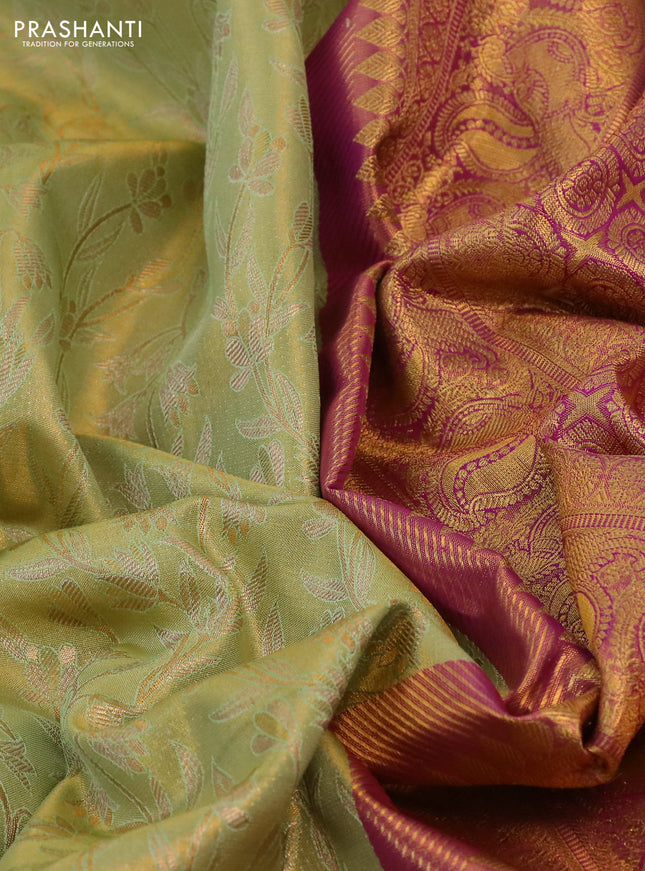 Kanchipuram tissue silk saree pista green and purple with allover zari woven floral brocade weaves and long rich peacock zari woven border