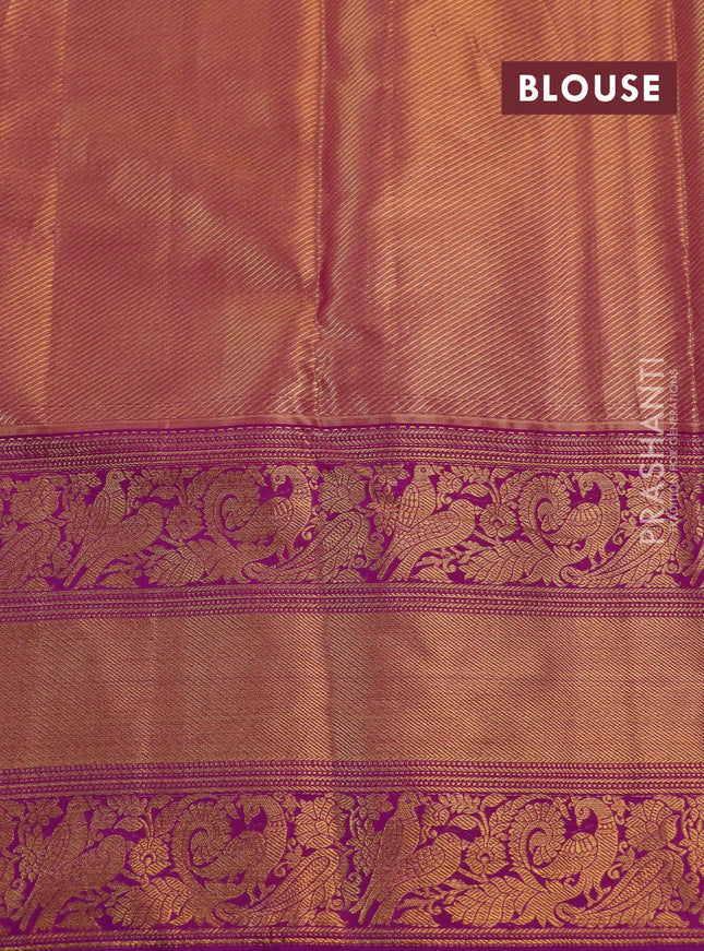 Kanchipuram tissue silk saree pista green and purple with allover zari woven floral brocade weaves and long rich peacock zari woven border