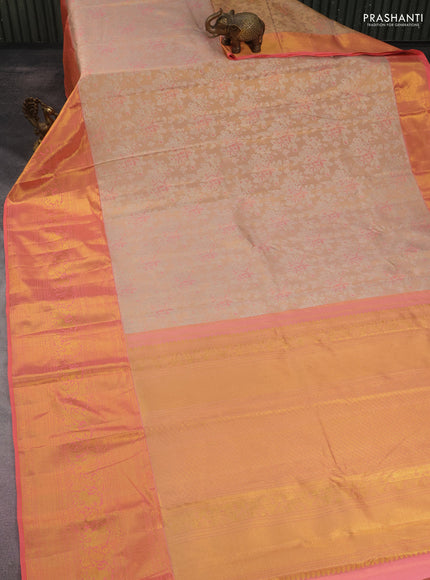 Kanchipuram tissue silk saree sandal and peach orange with allover silver zari woven floral brocade weaves and long rich zari woven border