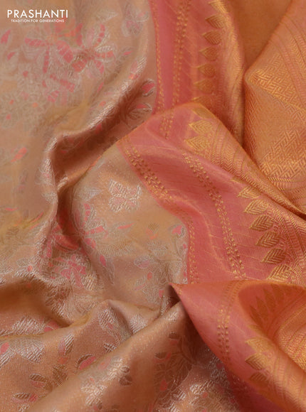 Kanchipuram tissue silk saree sandal and peach orange with allover silver zari woven floral brocade weaves and long rich zari woven border