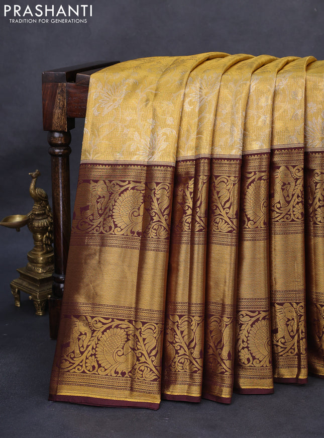 Kanchipuram tissue silk saree gold and wine shade with allover zari woven floral brocade weaves and long rich zari woven border