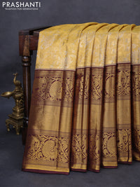 Kanchipuram tissue silk saree gold and wine shade with allover zari woven floral brocade weaves and long rich zari woven border