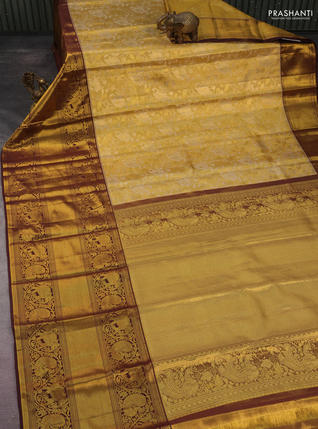 Kanchipuram tissue silk saree gold and wine shade with allover zari woven floral brocade weaves and long rich zari woven border