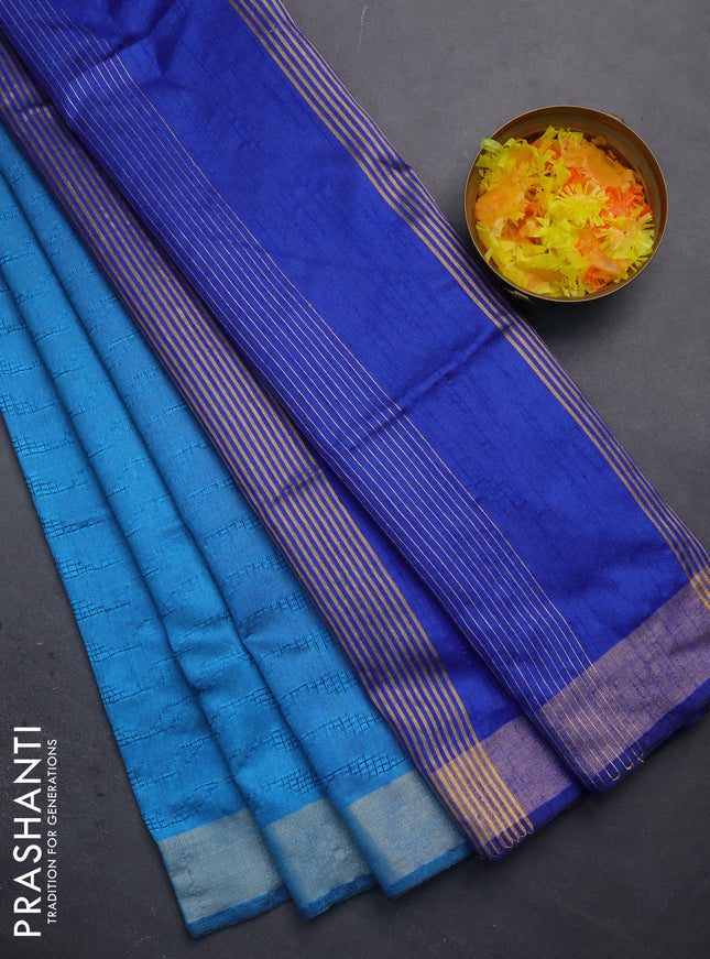 Semi dupion saree cs blue with allover self emboss and zari woven border