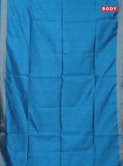 Semi dupion saree cs blue with allover self emboss and zari woven border