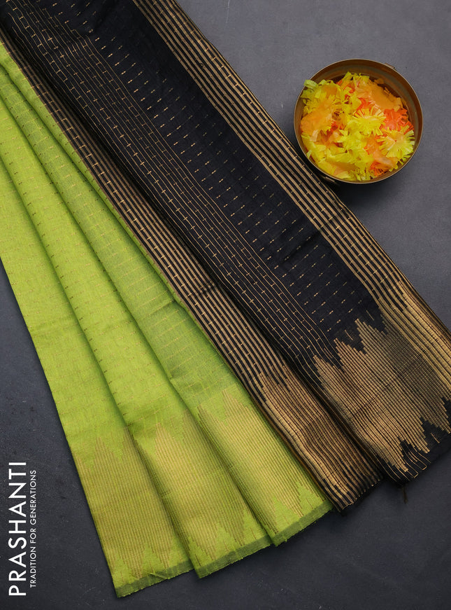 Semi dupion saree fluorescent green and black with allover zari woven butta weaves and temple zari woven border