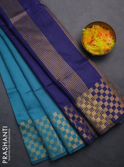 Semi dupion saree teal blue and blue with plain body and zari woven checked border