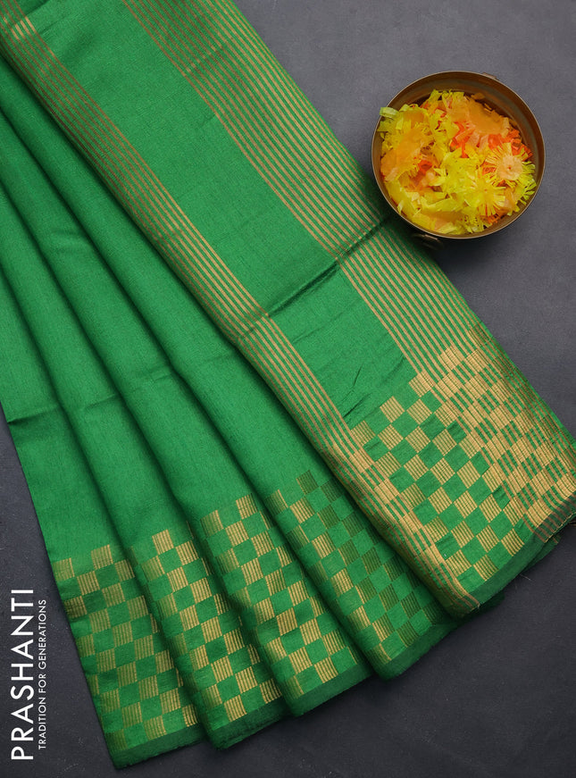 Semi dupion saree green with plain body and zari woven checked border