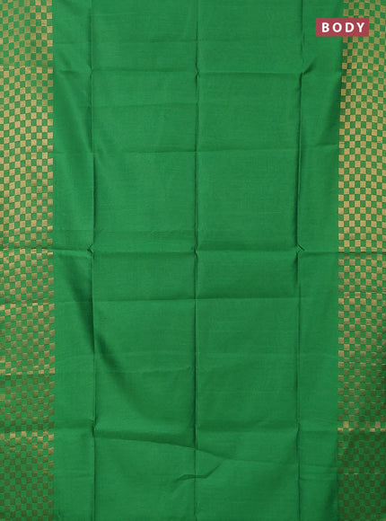 Semi dupion saree green with plain body and zari woven checked border