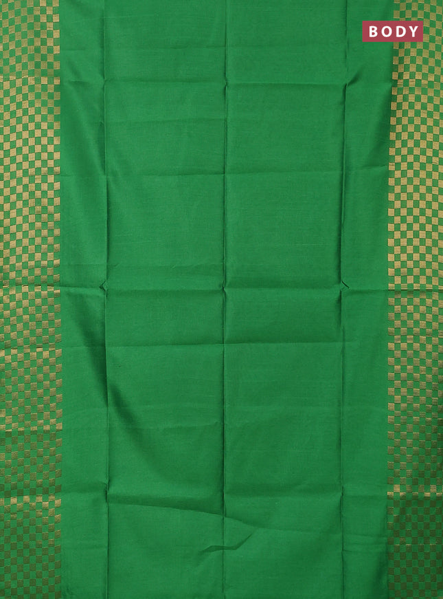 Semi dupion saree green with plain body and zari woven checked border