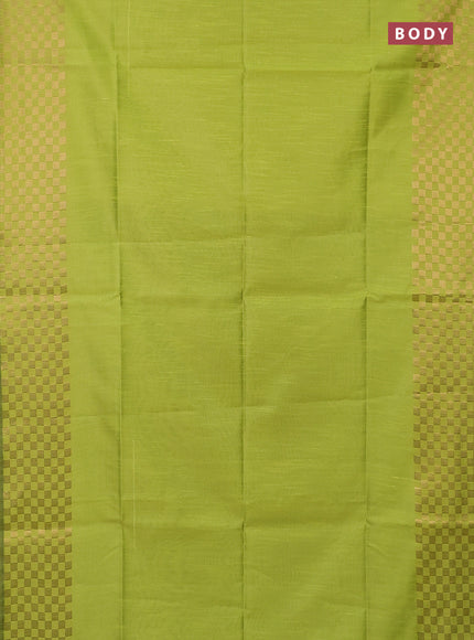 Semi dupion saree fluorescent green and black with plain body and zari woven checked border