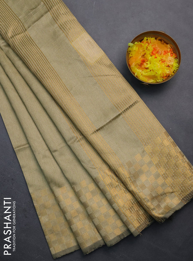 Semi dupion saree elaichi green with plain body and zari woven checked border