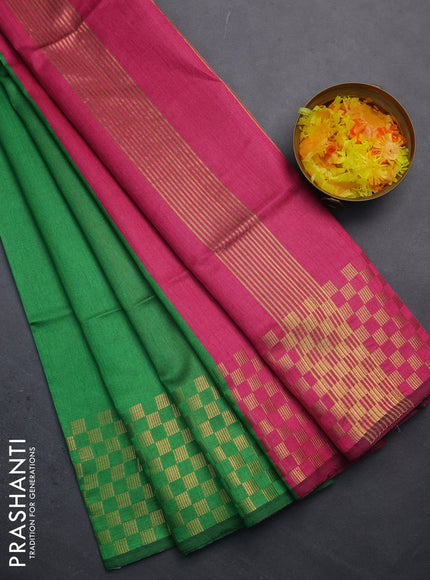 Semi dupion saree green and pink with plain body and zari woven checked border