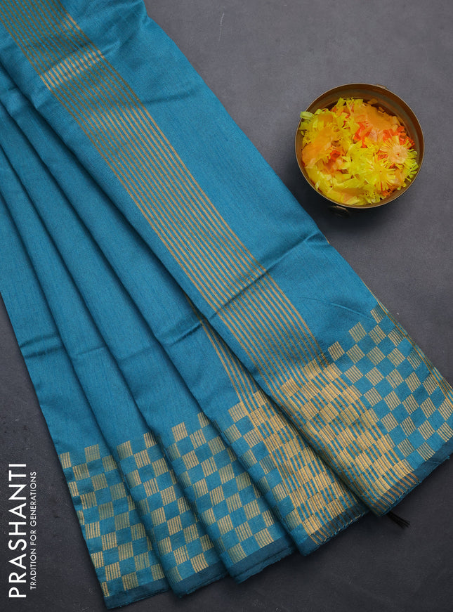 Semi dupion saree teal blue with plain body and zari woven checked border