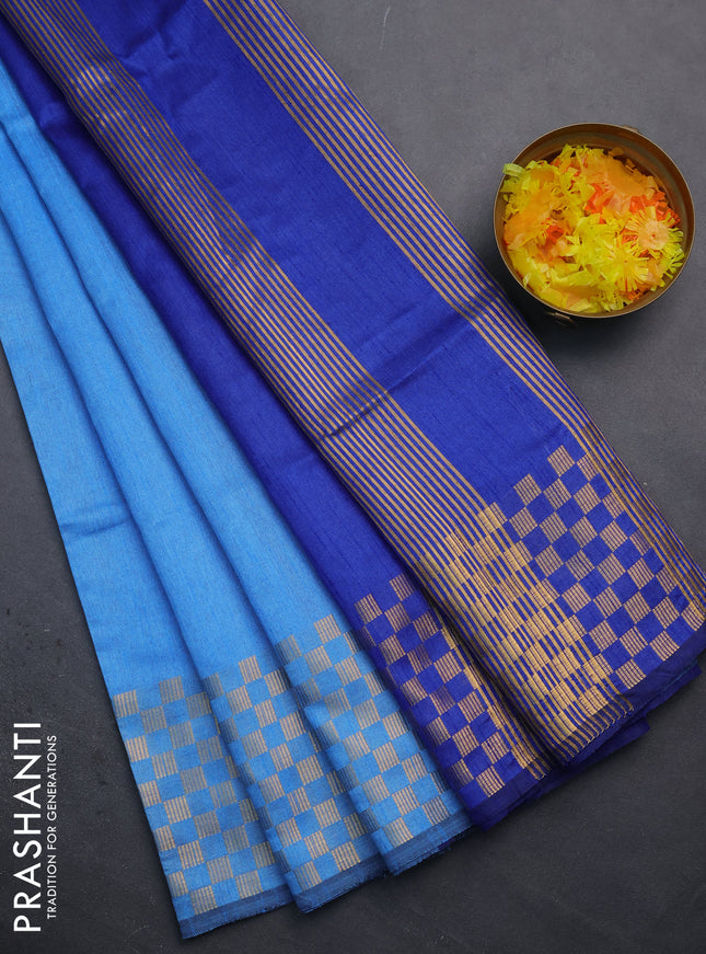 Semi dupion saree light blue and blue with plain body and zari woven checked border