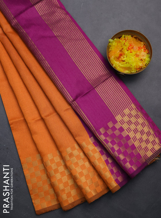 Semi dupion saree orange and purple with plain body and zari woven checked border