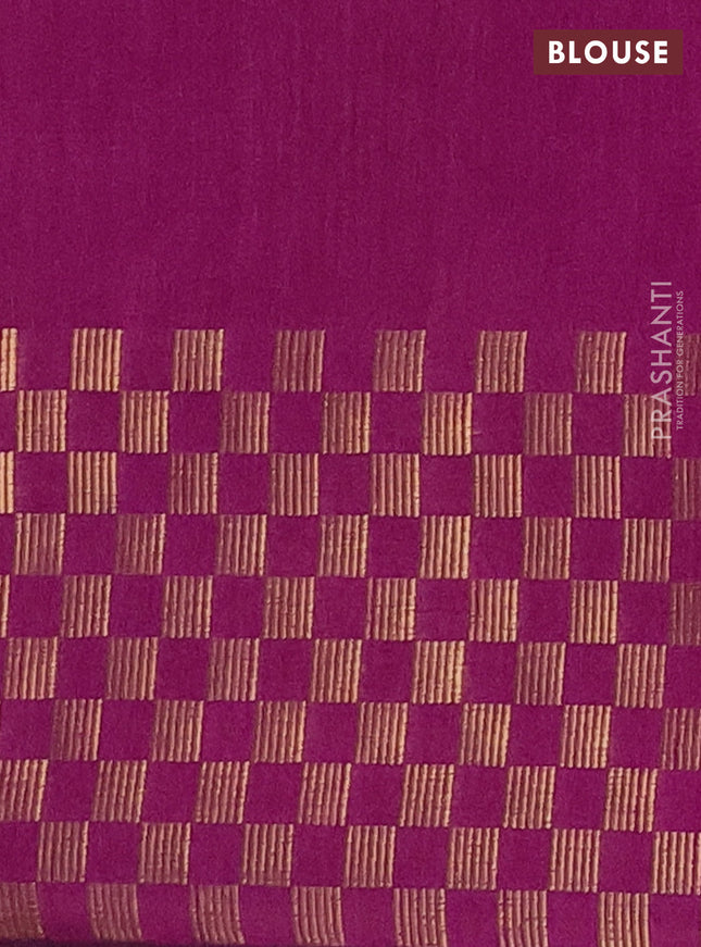 Semi dupion saree orange and purple with plain body and zari woven checked border