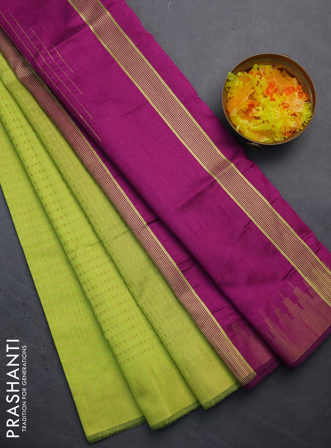 Semi dupion saree fluorescent green and purple with allover zari woven butta weaves and temple design zari woven border
