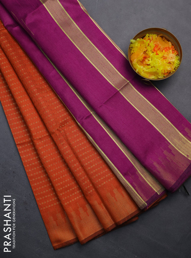 Semi dupion saree orange and purple with allover zari woven butta weaves and temple design zari woven border