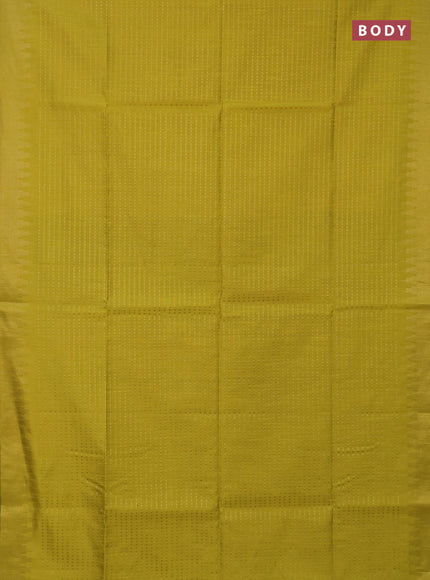 Semi dupion saree lime yellow and black with allover zari woven butta weaves and temple design zari woven border